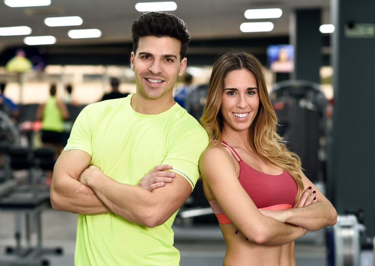 man-and-woman-personal-trainers-in-the-gym-M4ELNF5-1.jpg